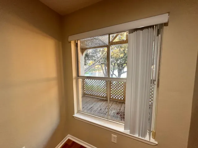 a view of a room that has a large window