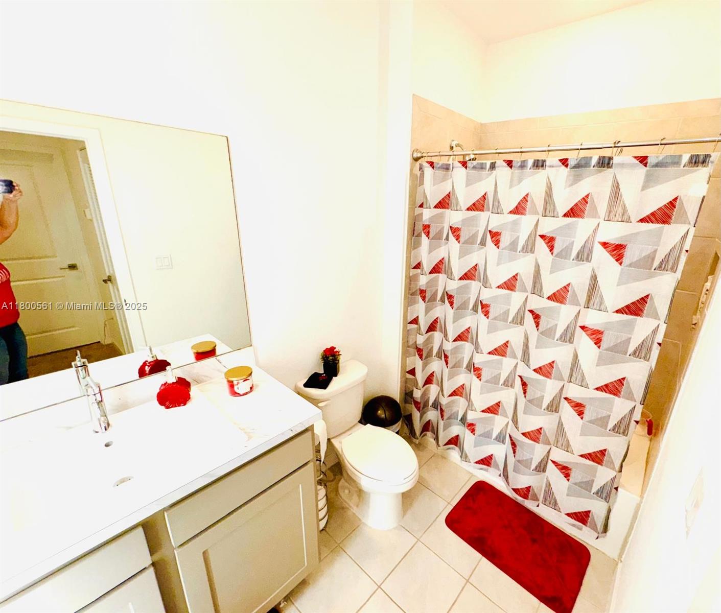 761 Southwest 11th Street, Unit 761 Florida City, FL 33034 - Photo 11 of 18 a bathroom with a sink toilet and shower