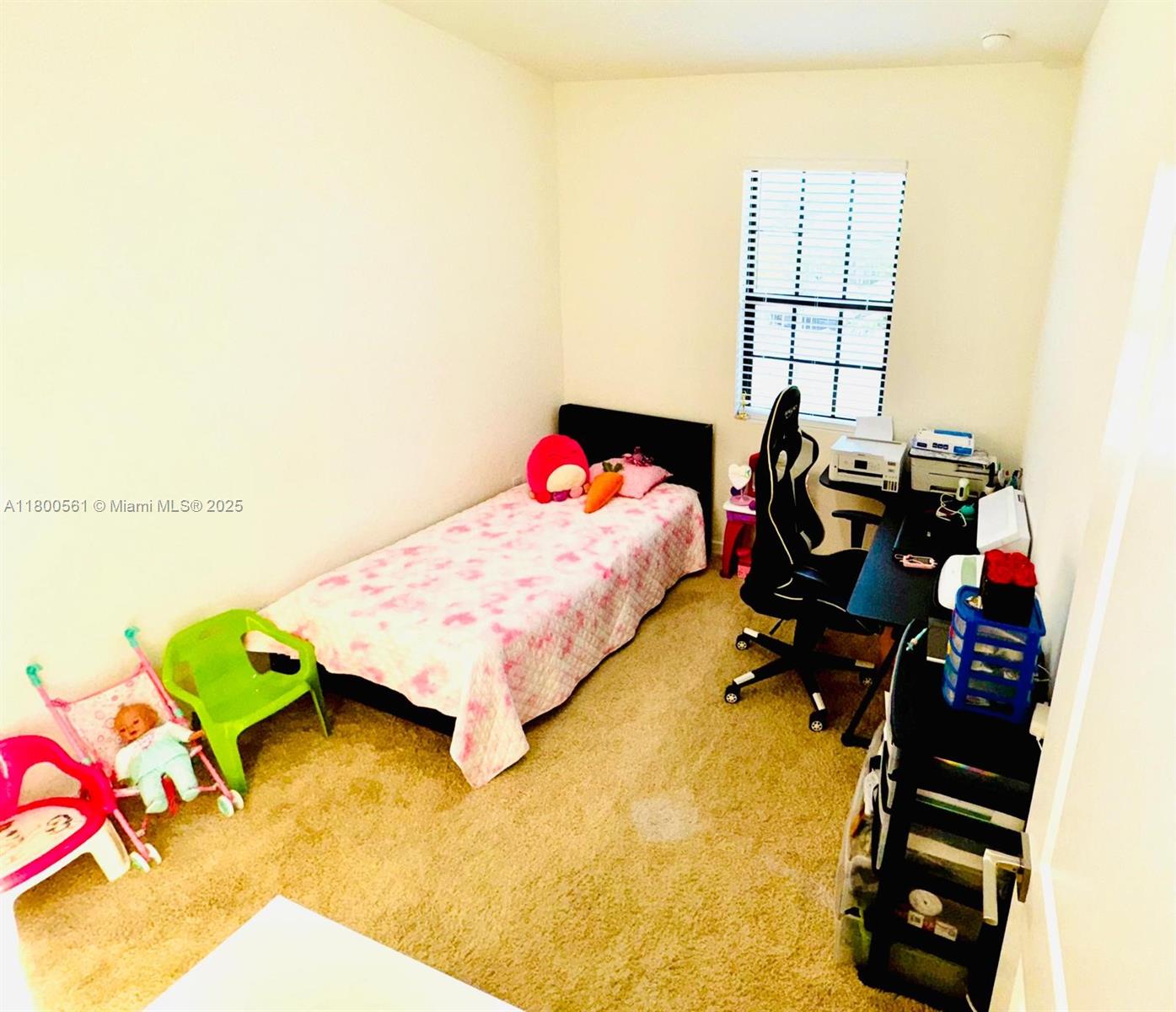 761 Southwest 11th Street, Unit 761 Florida City, FL 33034 - Photo 12 of 18 a bedroom with a bed and a dresser in it