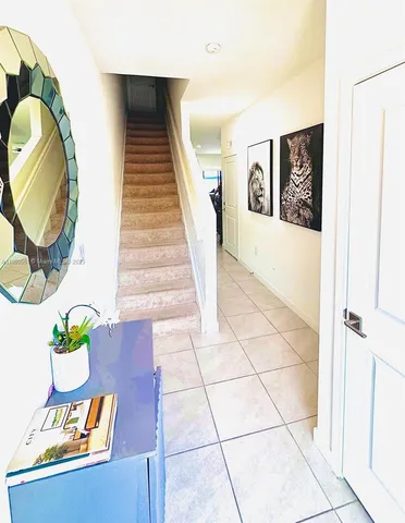 a view of an entryway with wooden floor