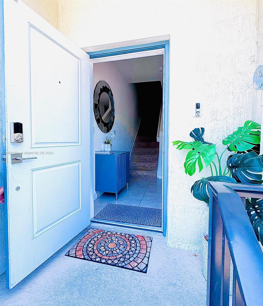 761 Southwest 11th Street, Unit 761 Florida City, FL 33034 - Photo 4 of 18 a living room with furniture and a potted plant