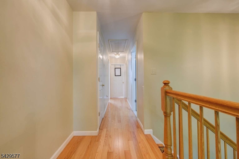 115 Constitution Way Bernards, NJ 07920 - Photo 15 of 31 a view of a hallway with wooden floor