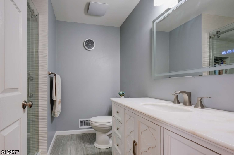 115 Constitution Way Bernards, NJ 07920 - Photo 16 of 31 a bathroom with a toilet sink and shower