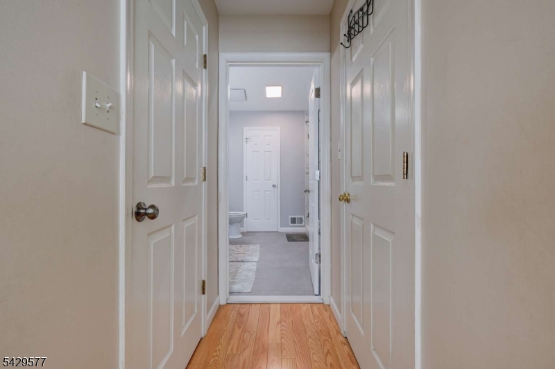115 Constitution Way Bernards, NJ 07920 - Photo 20 of 31 a view of a hallway with wooden floor