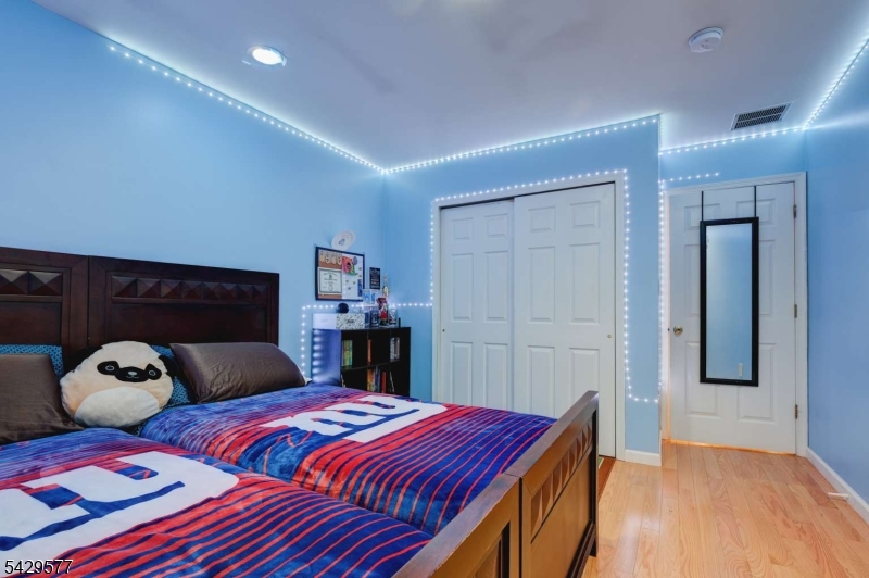 115 Constitution Way Bernards, NJ 07920 - Photo 24 of 31 a bedroom with a large bed and a large closet