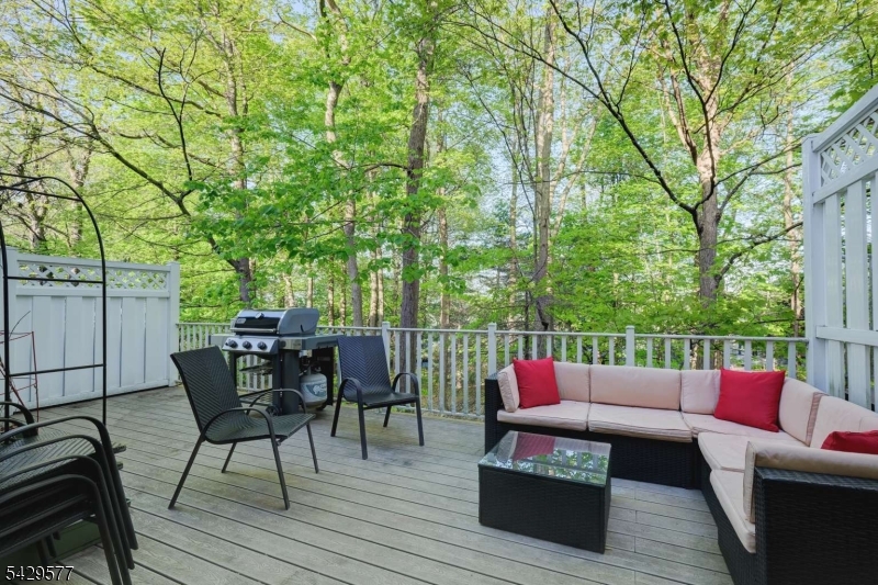 115 Constitution Way Bernards, NJ 07920 - Photo 25 of 31 a patio with hardwood table and chairs