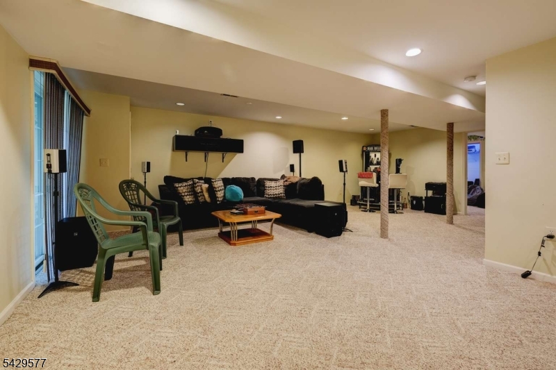 115 Constitution Way Bernards, NJ 07920 - Photo 27 of 31 a living room with furniture and a wooden floor