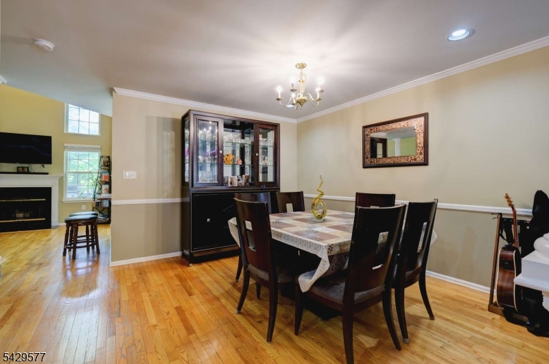 115 Constitution Way Bernards, NJ 07920 - Photo 5 of 31 a view of a dining room with furniture and wooden floor