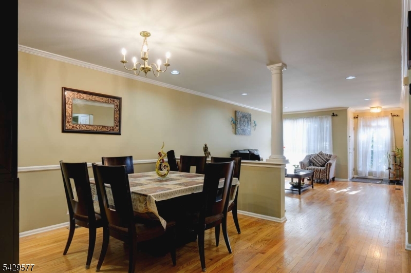 115 Constitution Way Bernards, NJ 07920 - Photo 6 of 31 a view of a dining room with furniture and wooden floor