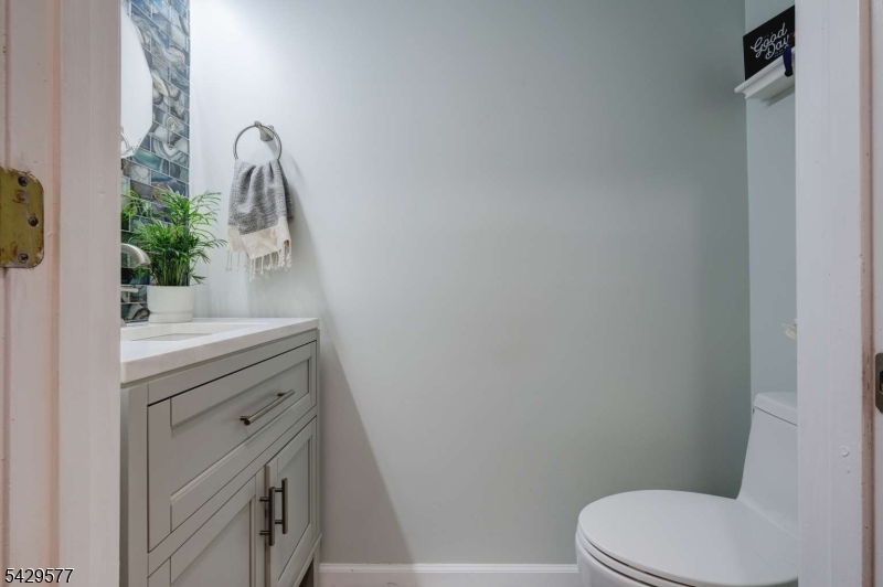 115 Constitution Way Bernards, NJ 07920 - Photo 7 of 31 a bathroom with a sink toilet and mirror