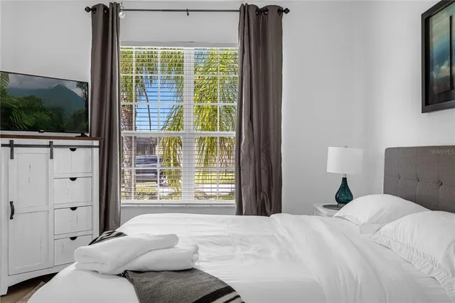 a bedroom with a bed and a walk in closet