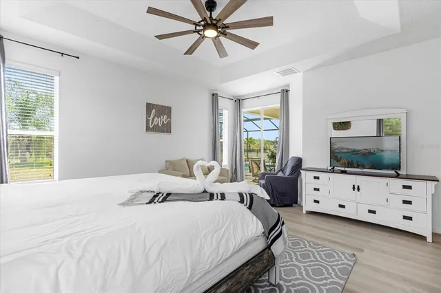 a view of a swimming pool with a yard