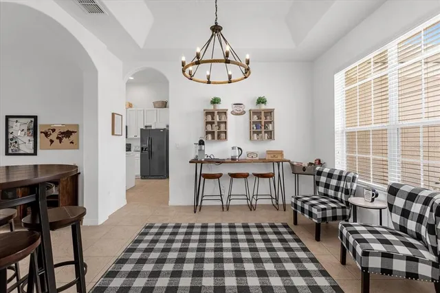 a bedroom with furniture and a window