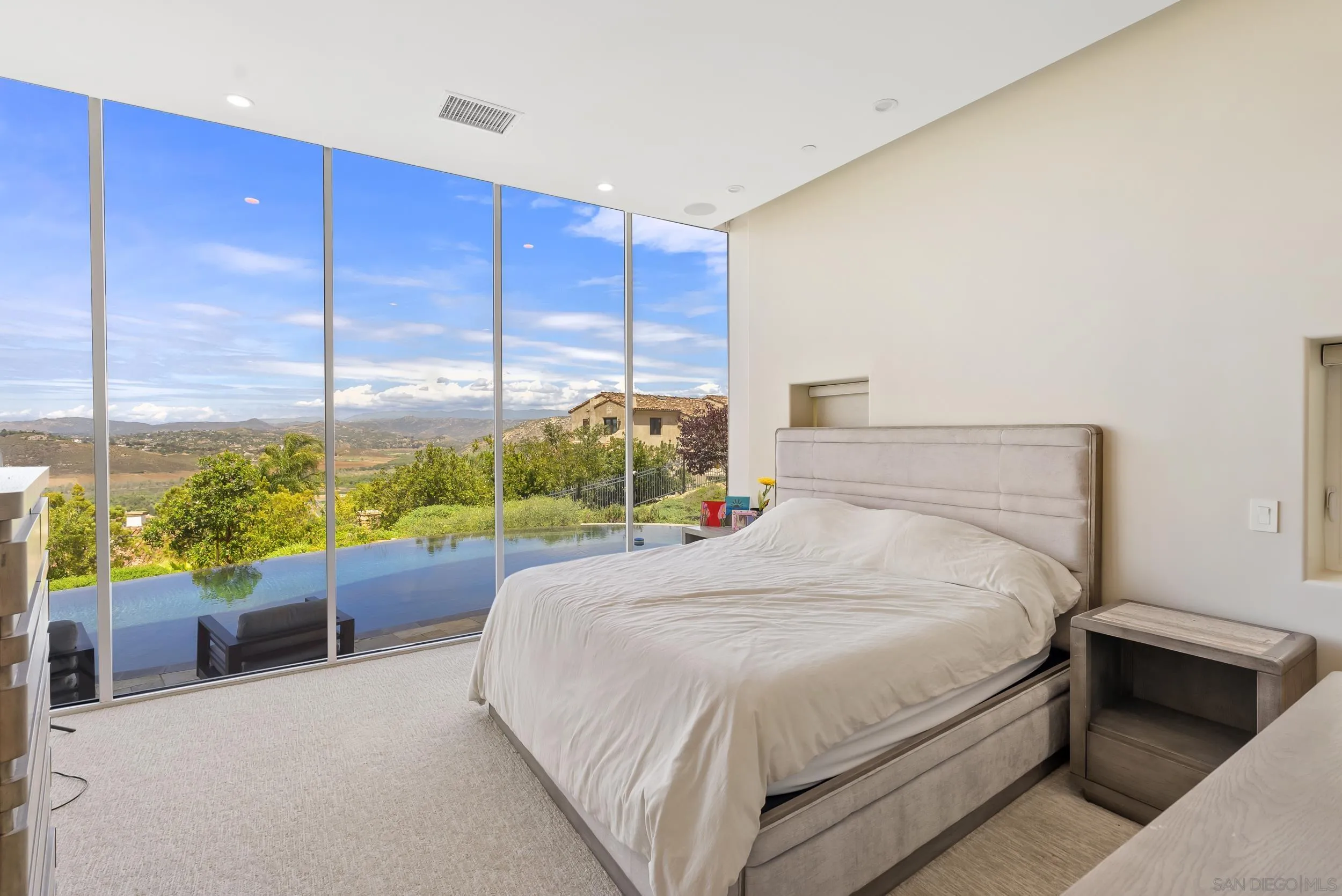 13220 Highlands Ranch Road Poway, CA 92064 - Photo 16 of 44 a bed sitting in a bedroom next to a window