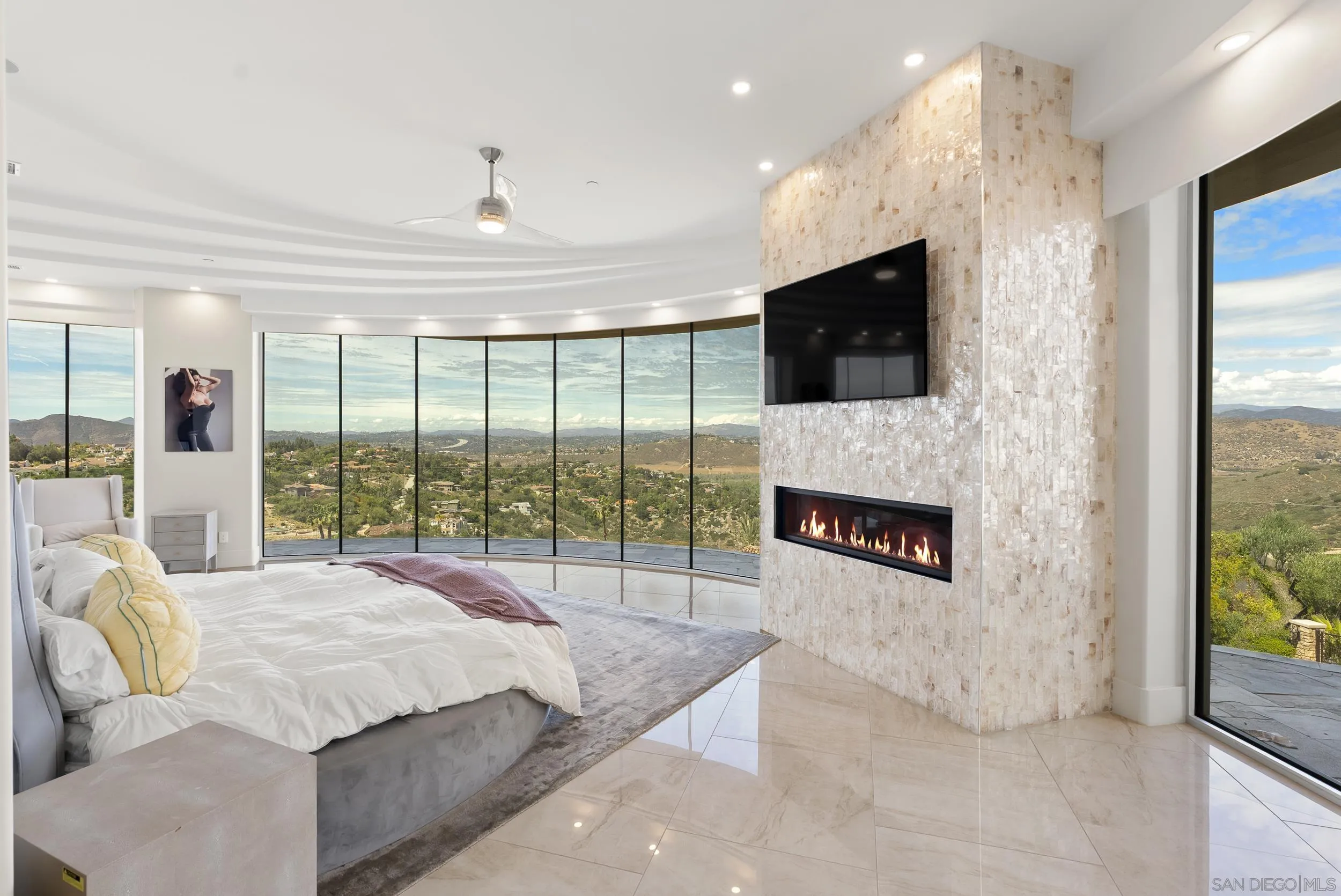13220 Highlands Ranch Road Poway, CA 92064 - Photo 21 of 44 a spacious bedroom with a balcony a bed and a television