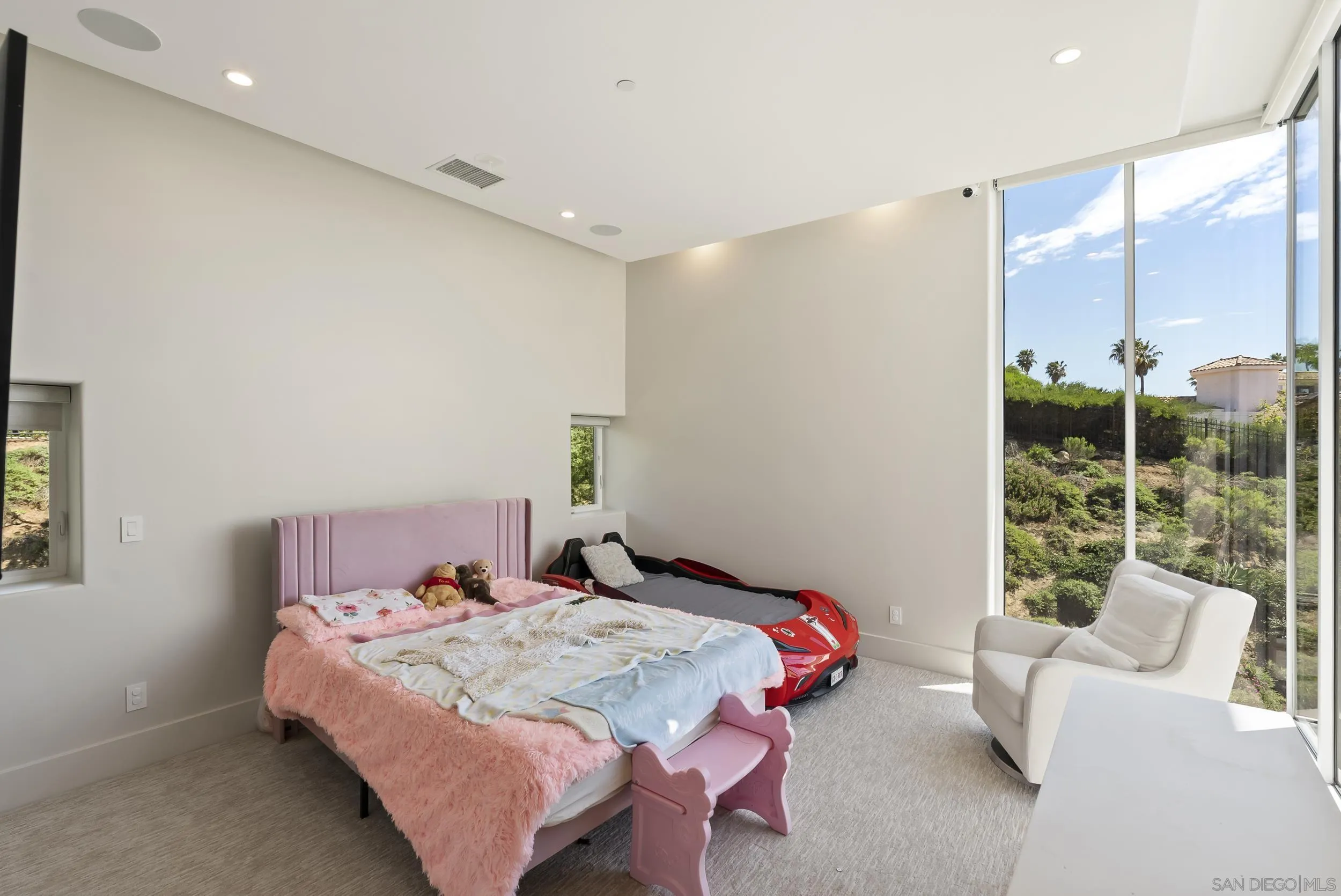 13220 Highlands Ranch Road Poway, CA 92064 - Photo 27 of 44 a bedroom with a bed and glass window