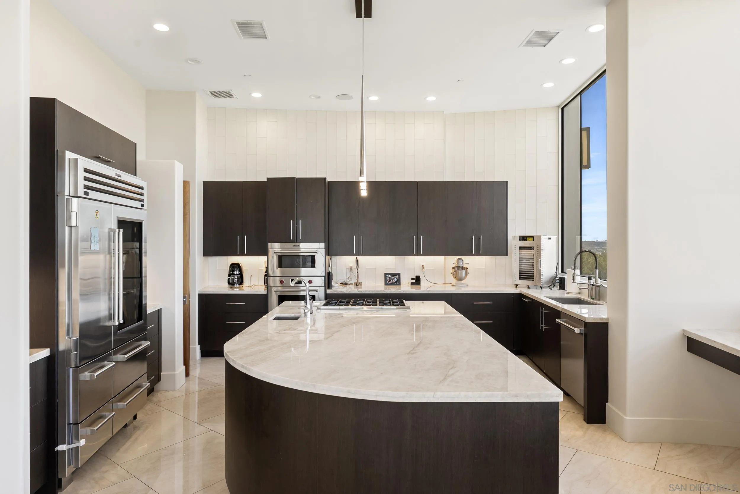 13220 Highlands Ranch Road Poway, CA 92064 - Photo 8 of 44 a kitchen with stainless steel appliances a sink stove and refrigerator
