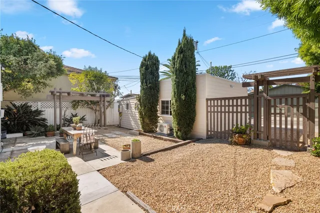 a view of a backyard with sitting area