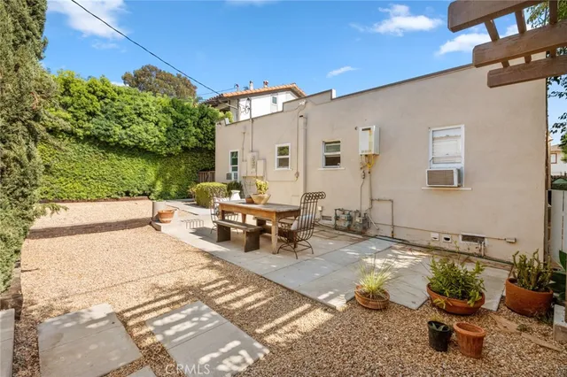 a view of a backyard with sitting area