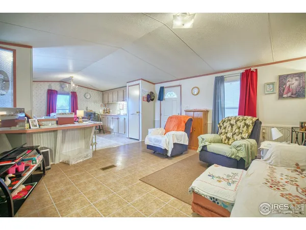 a bed room with furniture and a table