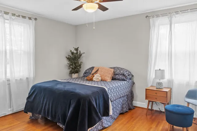 a bedroom with a bed and a chair