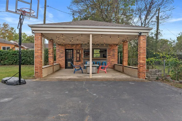 a view of a house with porch and chairs