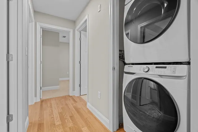 a view of a hallway with washer and dryer
