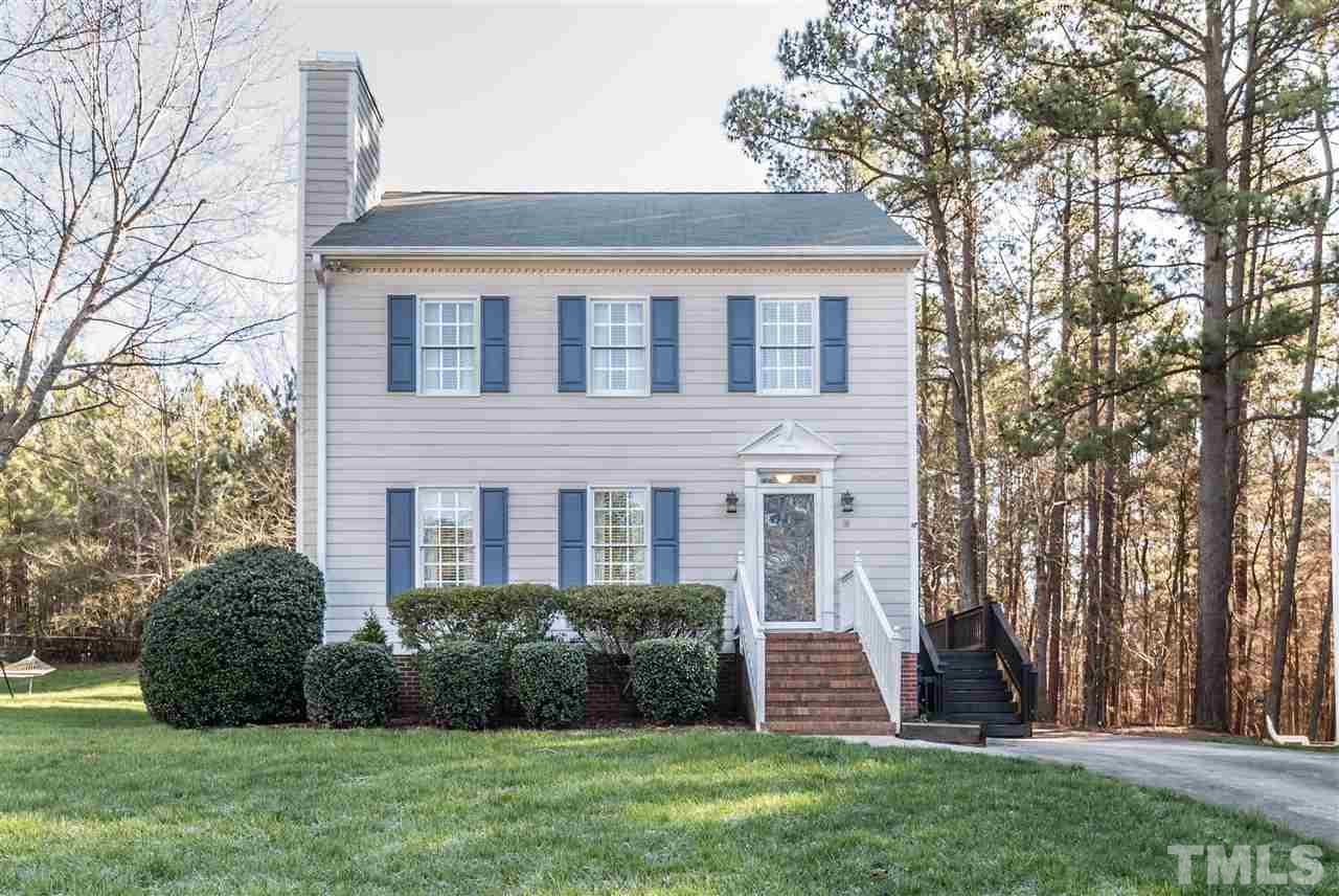 18 Striding Ridge Court Durham, NC 27713 - Photo 1 of 22 a front view of a house with a garden and yard