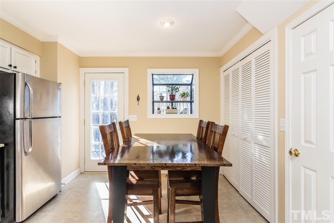 18 Striding Ridge Court Durham, NC 27713 - Photo 11 of 22 a view of a dining room with furniture window and wooden floor