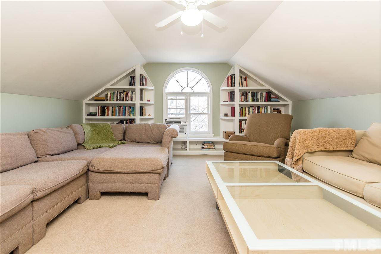18 Striding Ridge Court Durham, NC 27713 - Photo 17 of 22 a living room with furniture and a large window