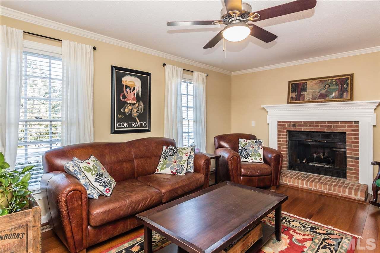 18 Striding Ridge Court Durham, NC 27713 - Photo 3 of 22 a living room with furniture and a fireplace