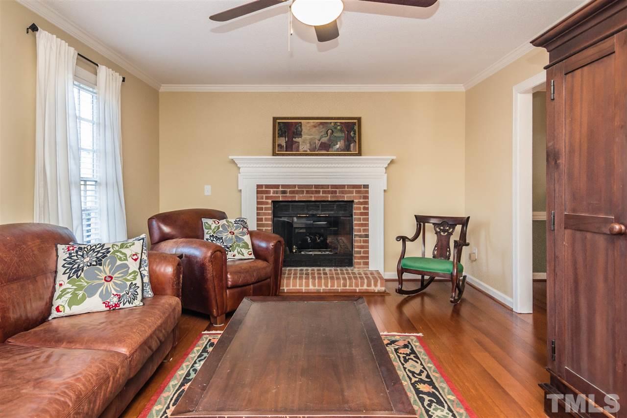 18 Striding Ridge Court Durham, NC 27713 - Photo 4 of 22 a living room with furniture and a fireplace