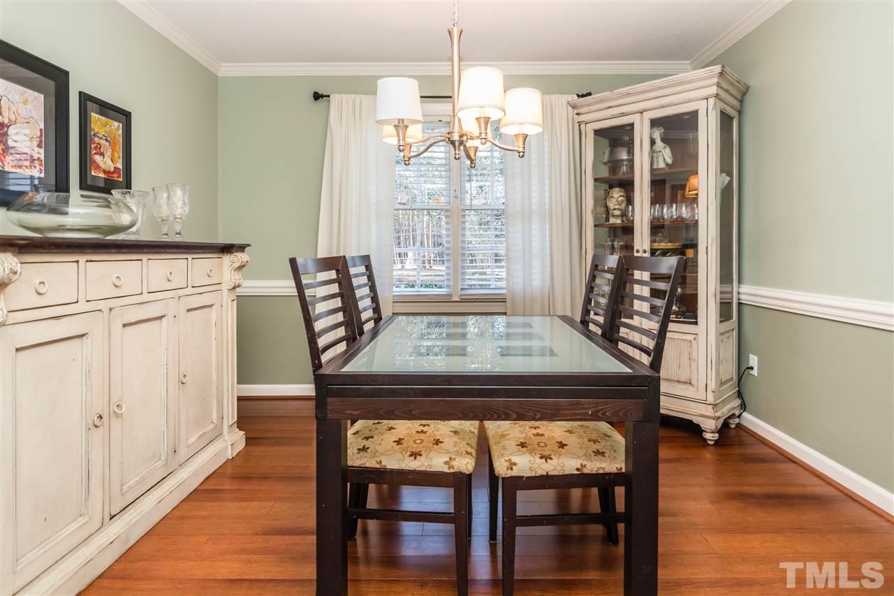 18 Striding Ridge Court Durham, NC 27713 - Photo 6 of 22 a view of a dining room with furniture and wooden floor