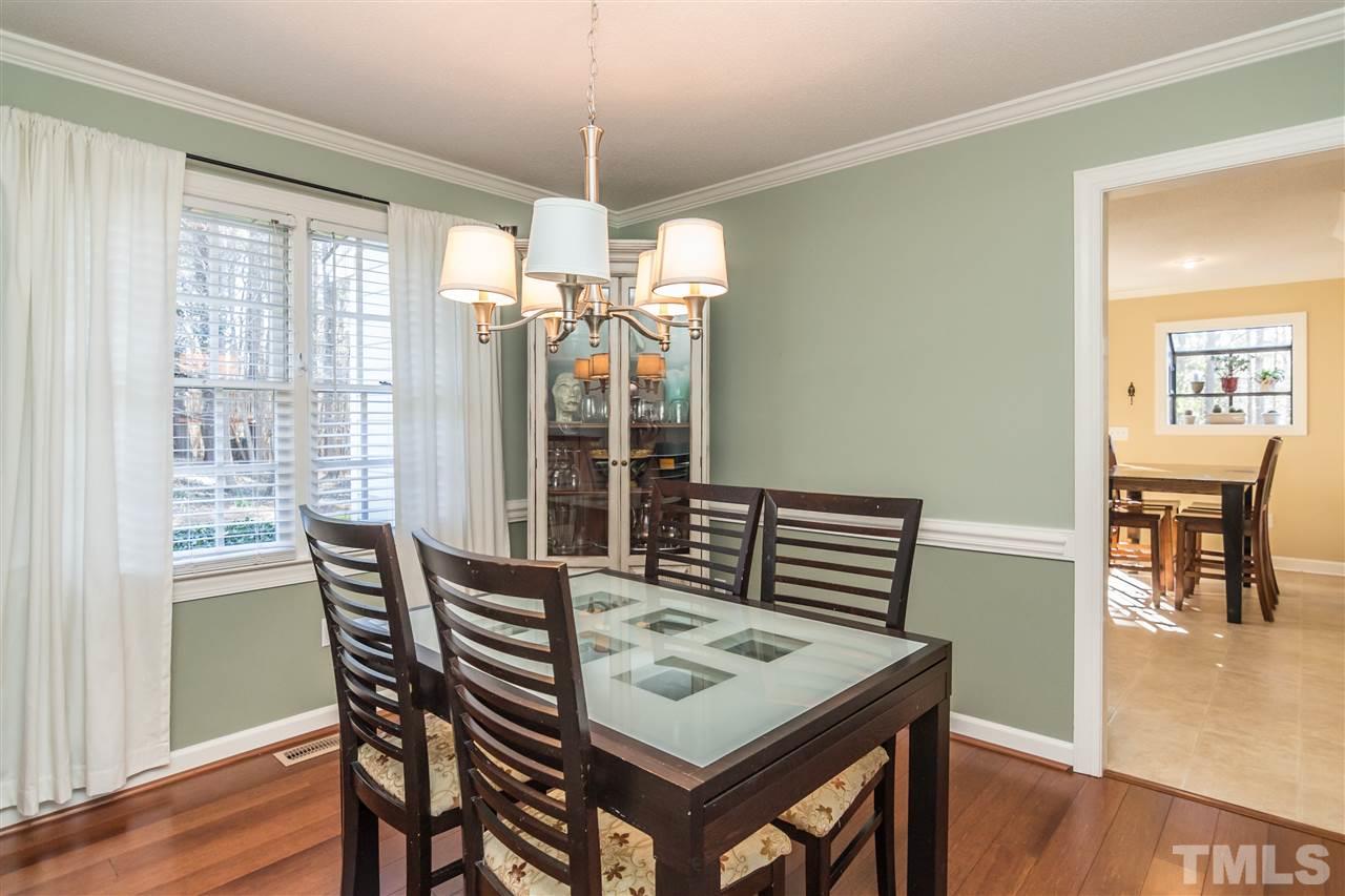18 Striding Ridge Court Durham, NC 27713 - Photo 7 of 22 a view of a dining room with furniture window and wooden floor