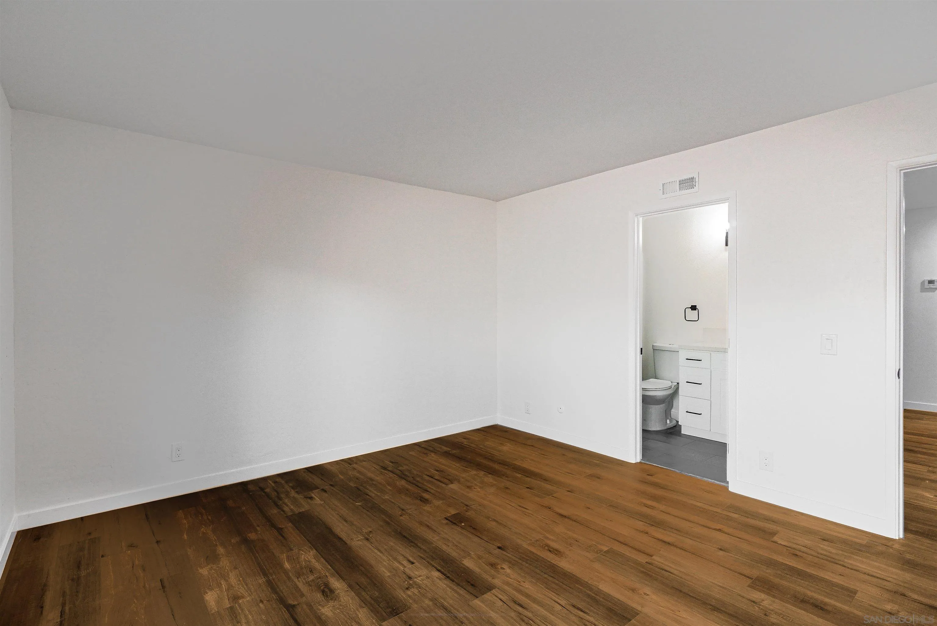 14558 Silla Street Poway, CA 92064 - Photo 15 of 20 a view of empty room with wooden floor