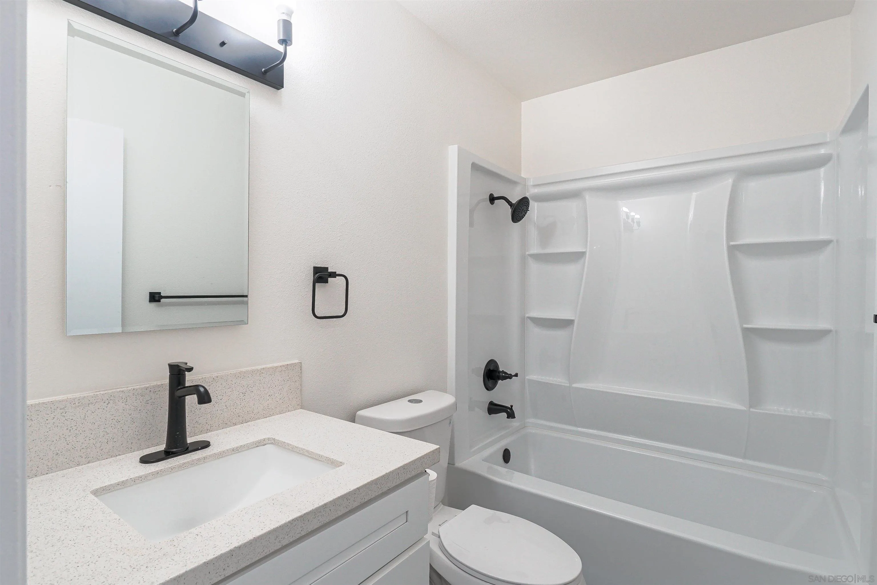 14558 Silla Street Poway, CA 92064 - Photo 8 of 20 a bathroom with a sink toilet and shower