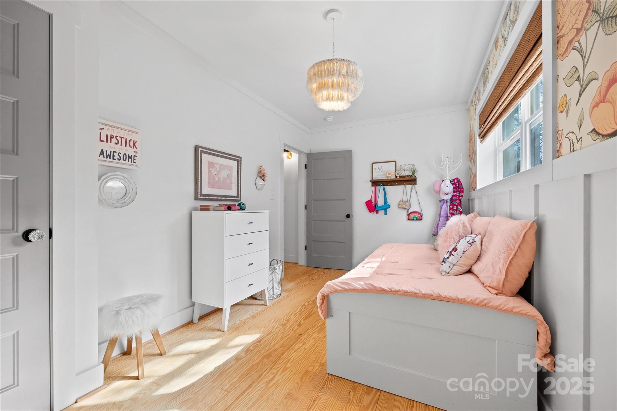 408 Morgan Street Fort Mill, SC 29715 - Photo 19 of 29 a bedroom with a bed and a chandelier