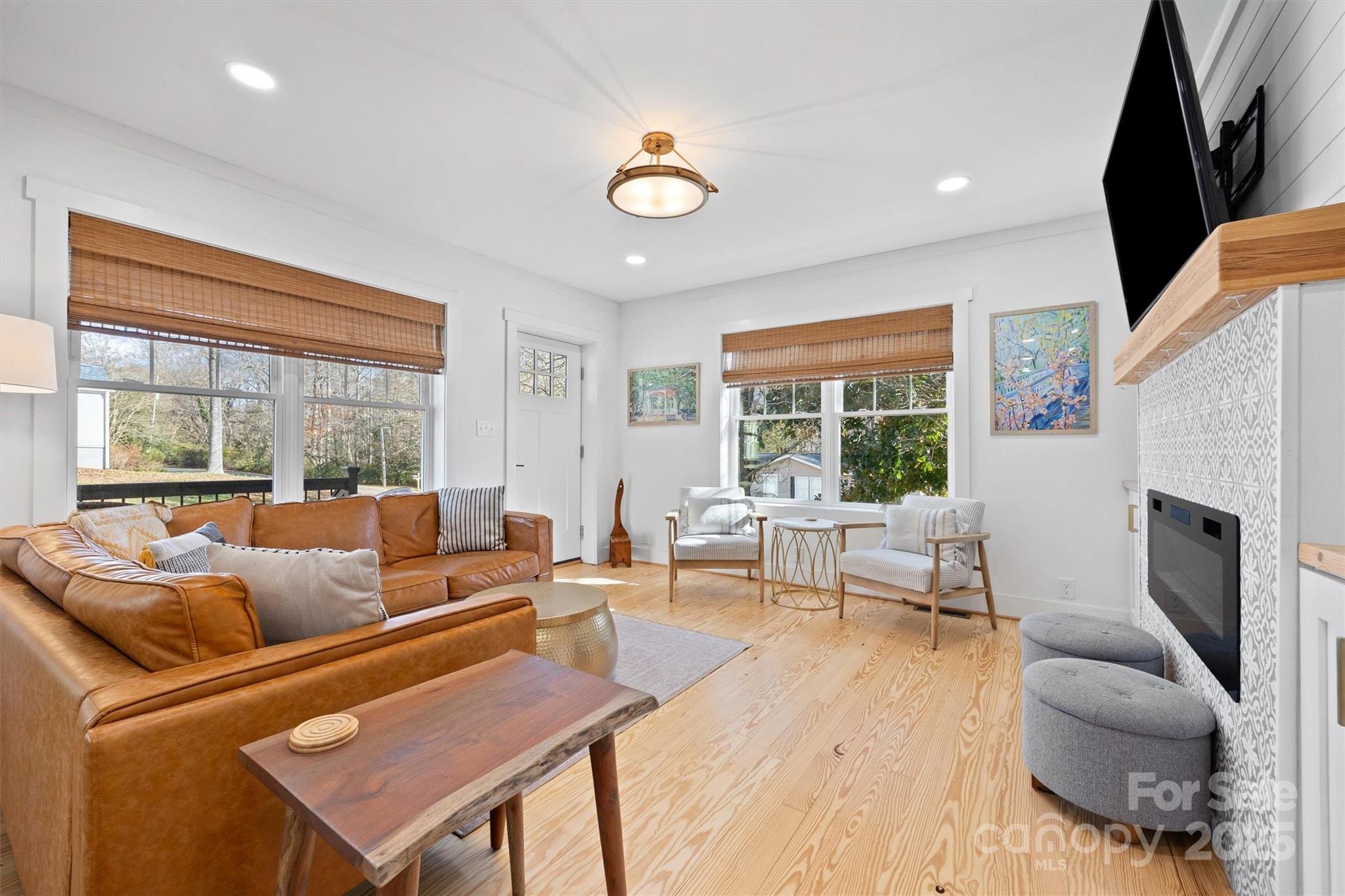 408 Morgan Street Fort Mill, SC 29715 - Photo 5 of 29 a living room with furniture fireplace and a large window