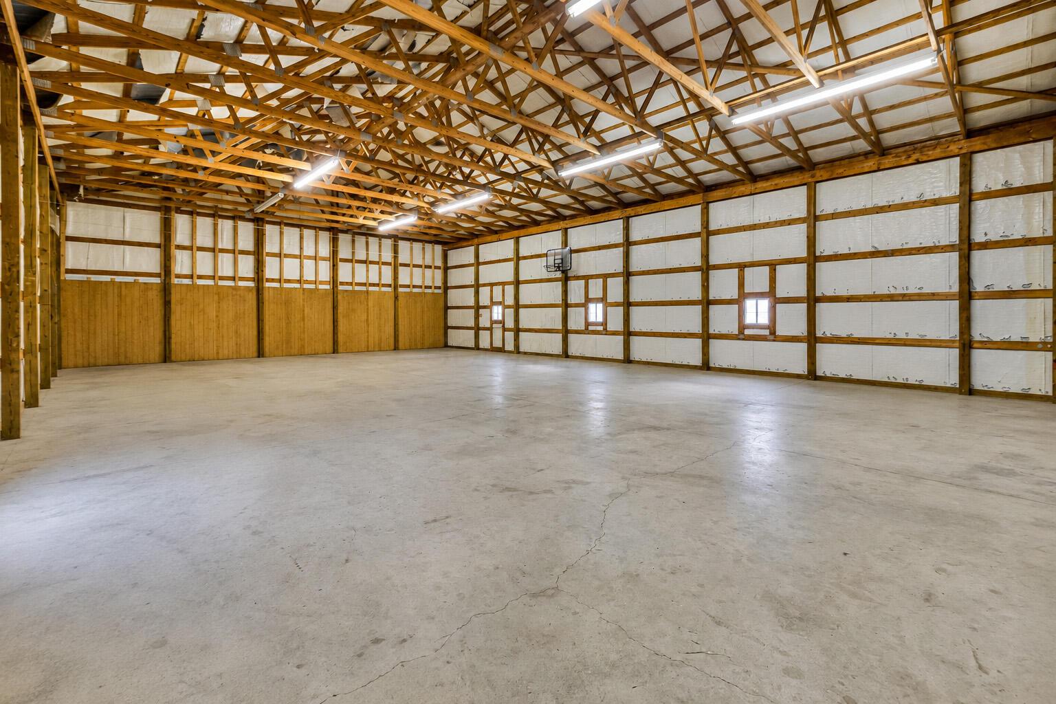 16689 Bailor Road Laurelville, OH 43135 - Photo 61 of 73 • Aluminum exterior
• Concrete floor
• Insulated walls & ceiling
• Extra tall door
• Electric tied to house
• Man door
• 14’ x 12’ door