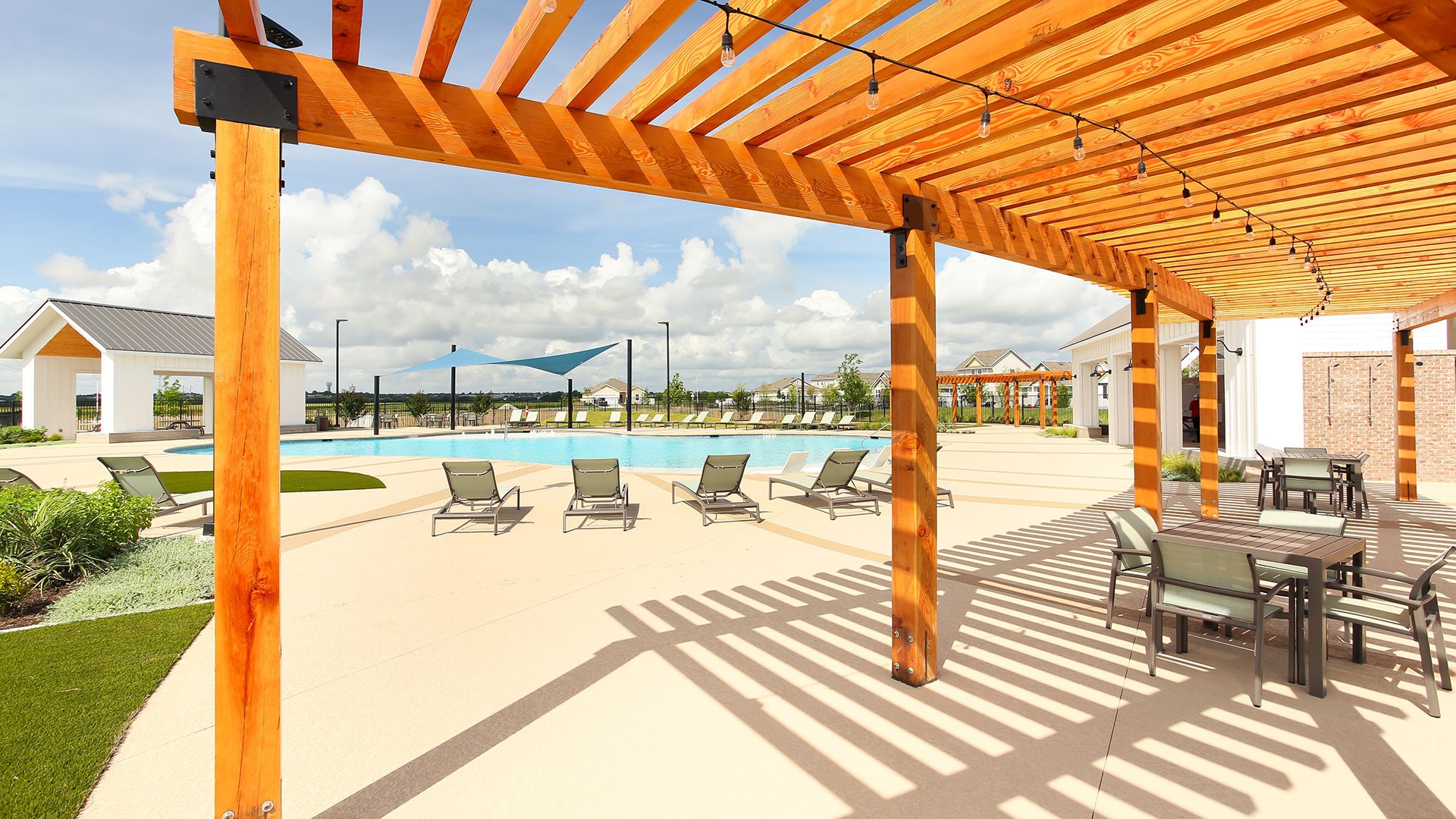 3073 Winding Creek Road Kyle, TX 78640 - Photo 22 of 24 a view of a swimming pool with outdoor seating
