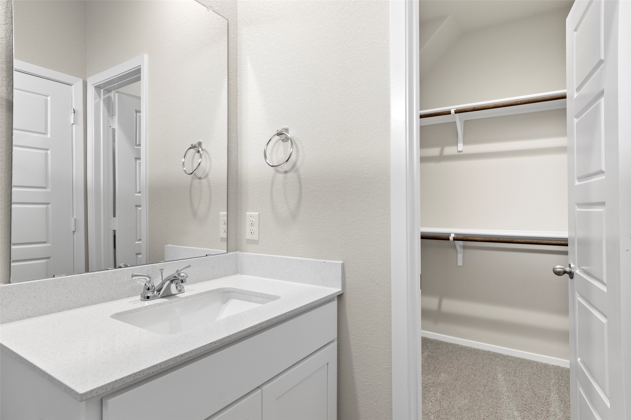3073 Winding Creek Road Kyle, TX 78640 - Photo 8 of 24 a bathroom with a sink and a mirror