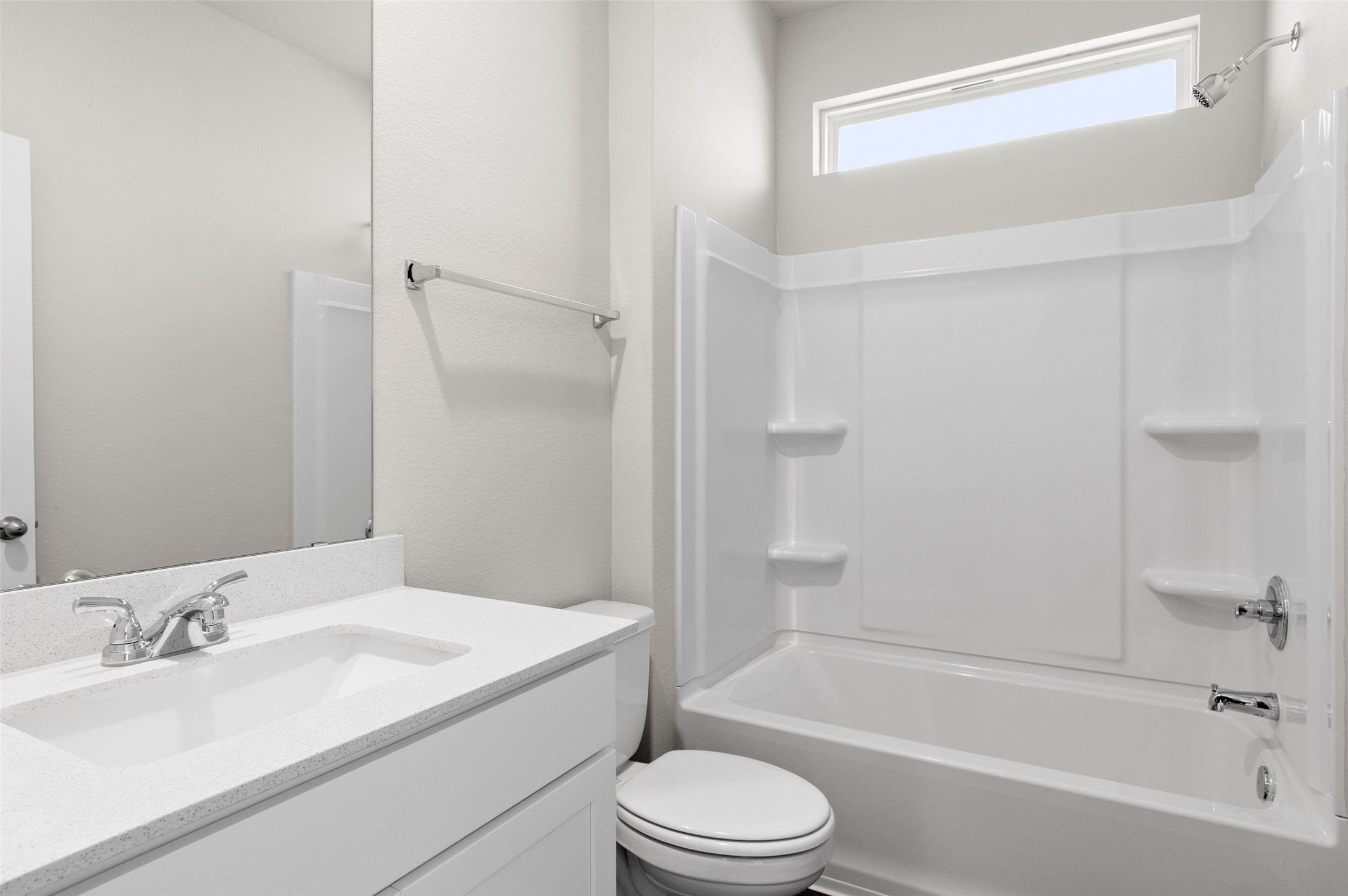 3073 Winding Creek Road Kyle, TX 78640 - Photo 10 of 24 a bathroom with a bathtub shower sink vanity mirror and toilet