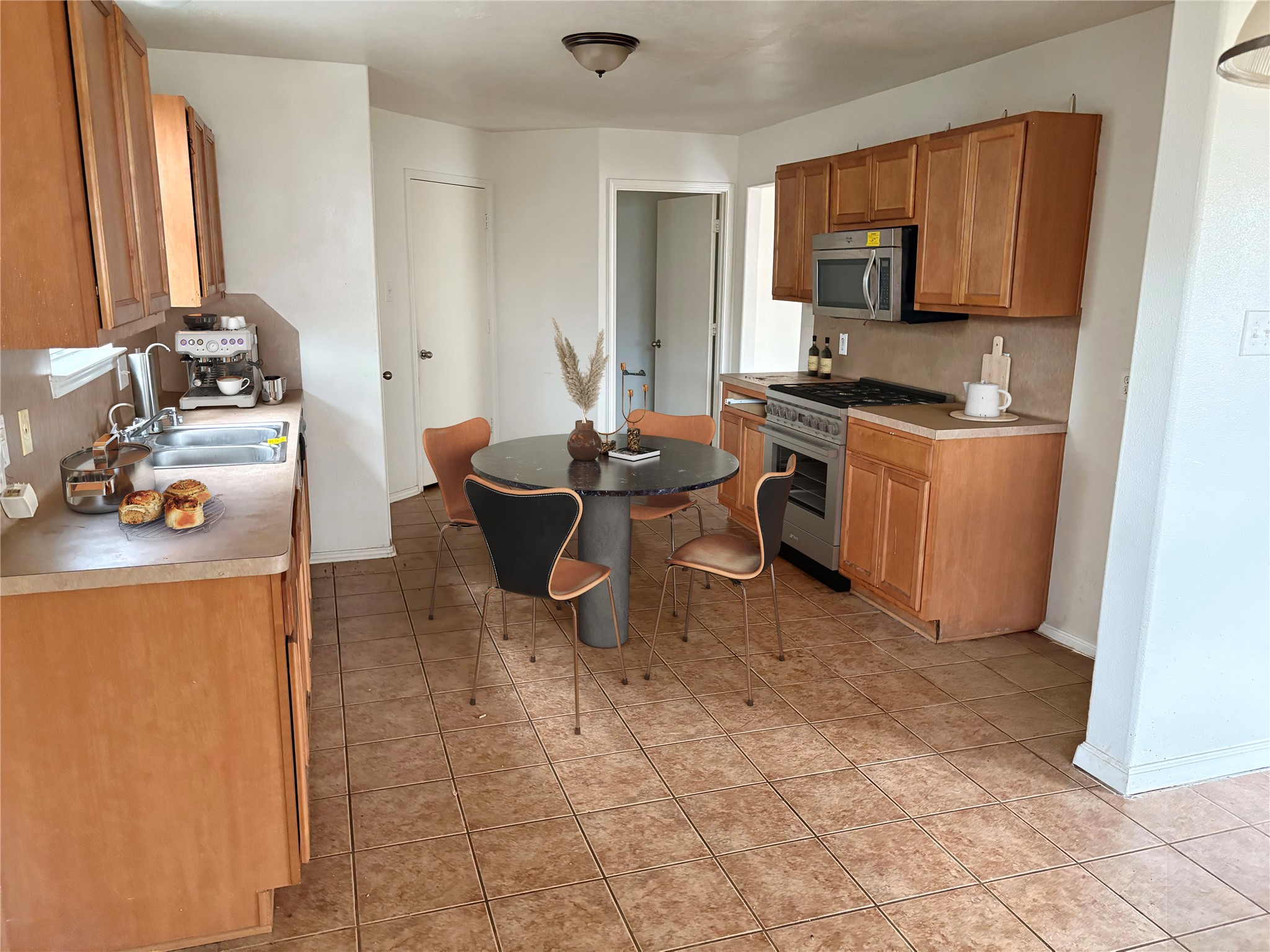 14411 Brunswick Point Lane Houston, TX 77047 - Photo 4 of 7 a kitchen with a sink cabinets and appliances