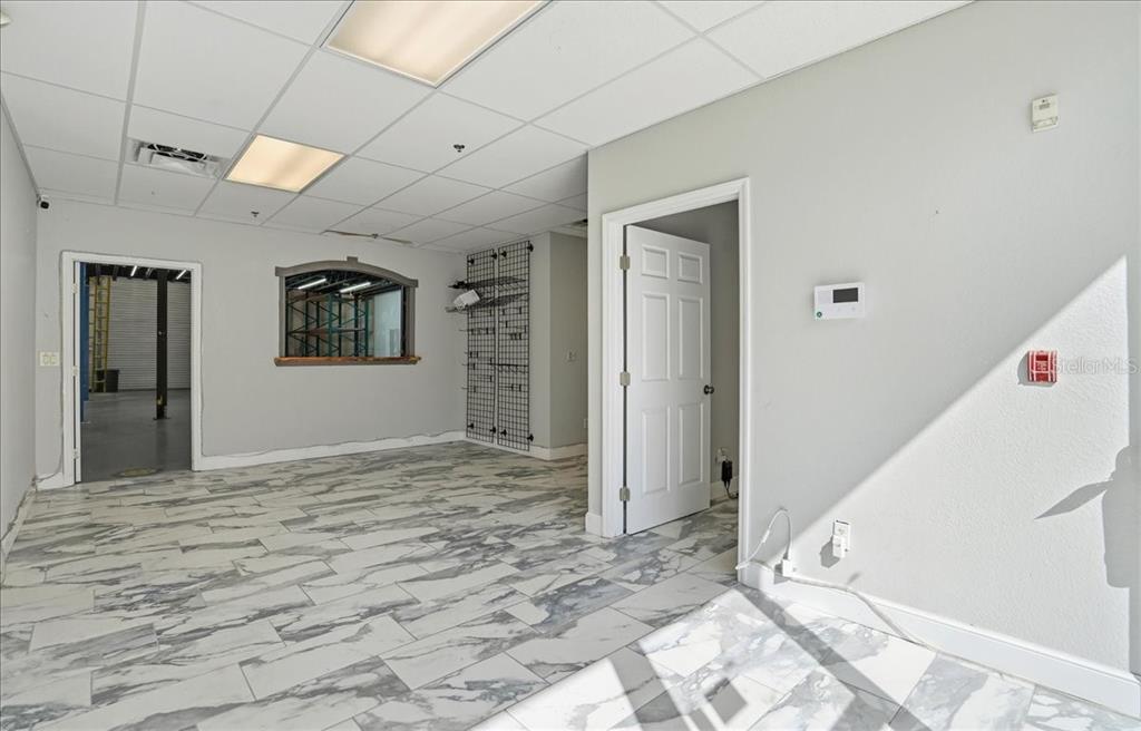 6321 Porter Road, Unit 2 Sarasota, FL 34240 - Photo 5 of 32 a view of a livingroom with wooden floor and window