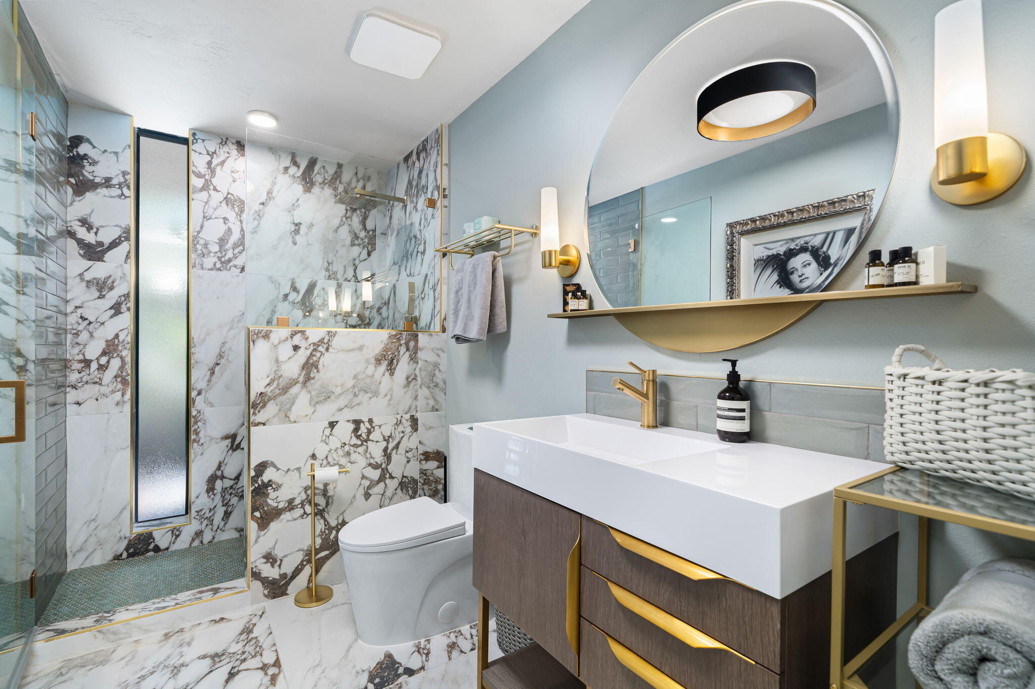 88 Princeton Drive Rancho Mirage, CA 92270 - Photo 27 of 37 a bathroom with a sink a toilet and a shower curtain