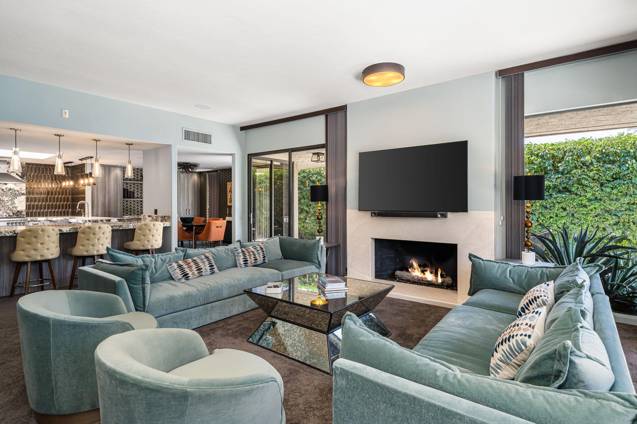 88 Princeton Drive Rancho Mirage, CA 92270 - Photo 6 of 37 a living room with furniture a fireplace and a flat screen tv