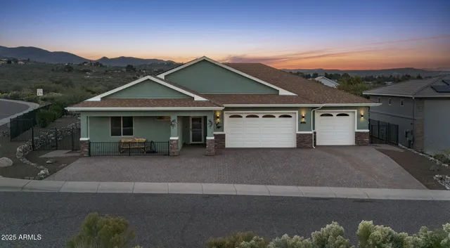 a front view of a house with a garage