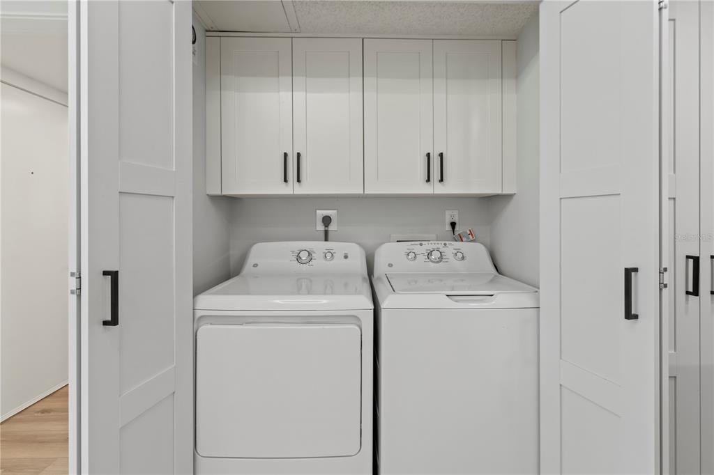 609 Bayport Way, Unit 609 Longboat Key, FL 34228 - Photo 15 of 77 a utility room with dryer and washer