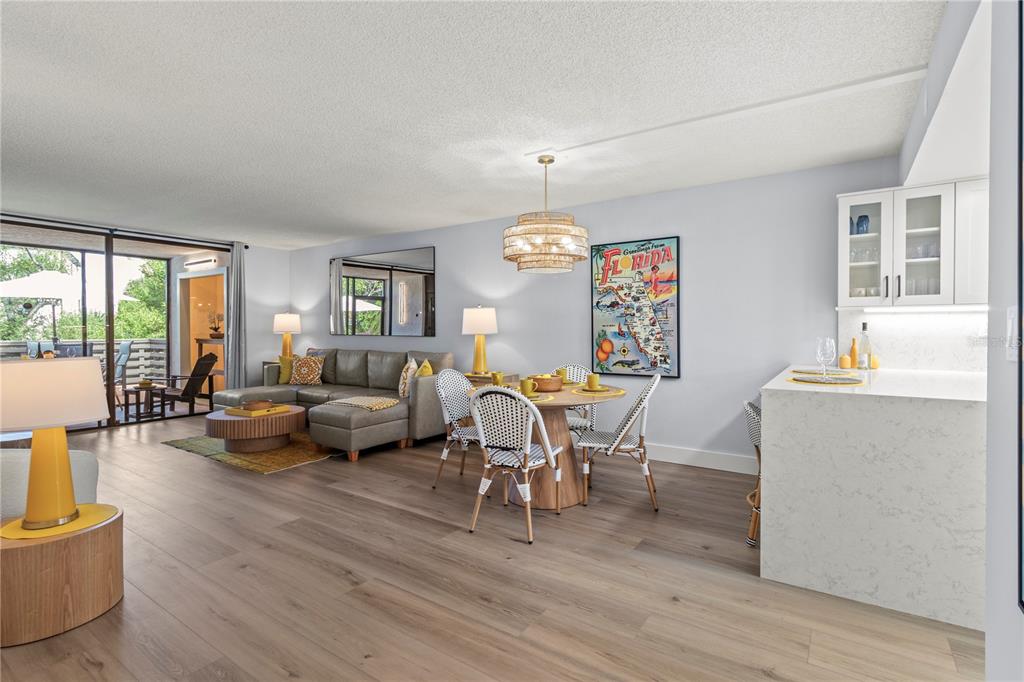 609 Bayport Way, Unit 609 Longboat Key, FL 34228 - Photo 16 of 77 a living room with furniture fireplace and large windows