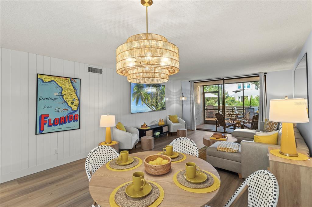 609 Bayport Way, Unit 609 Longboat Key, FL 34228 - Photo 19 of 77 a living room with couches and a chandelier